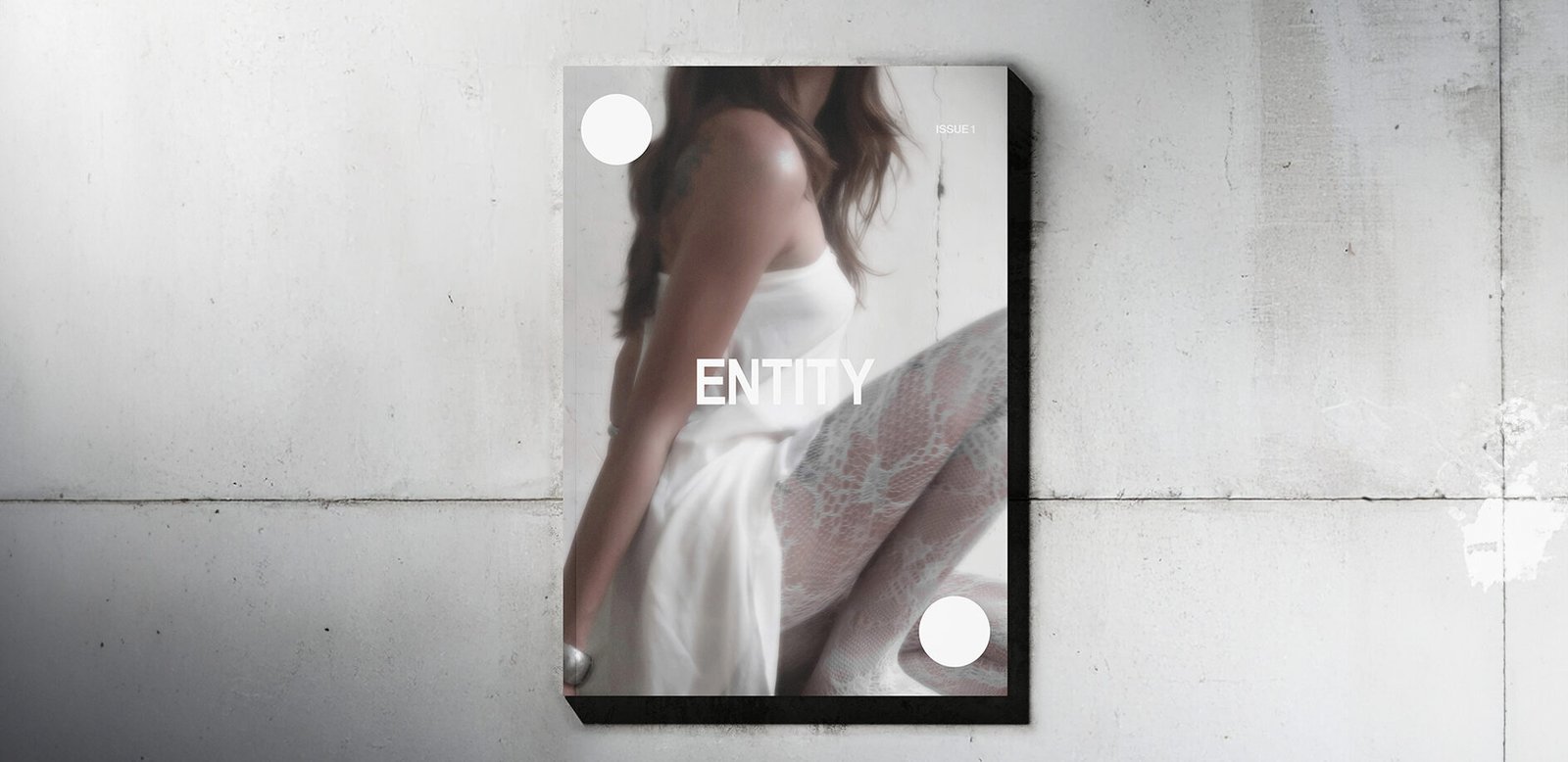 ENTITY magazine on a concrete wall